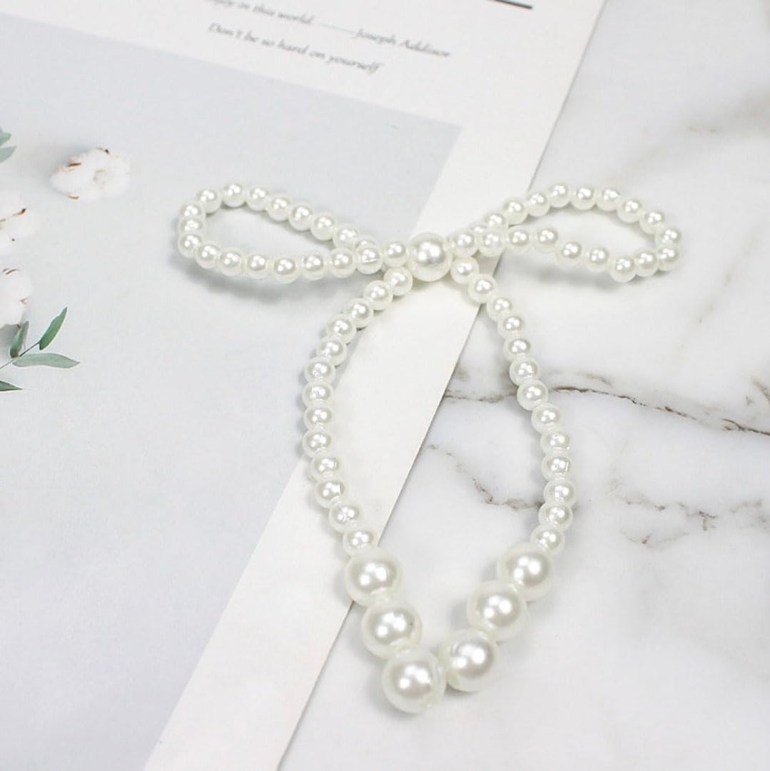 12pc pearl Bow.