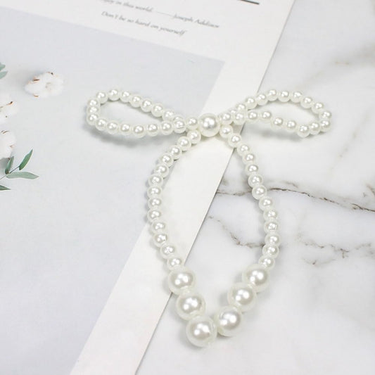 12pc pearl Bow.